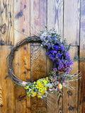 Grapevine wreath with dried flowers