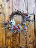 Grapevine wreath with dried flowers